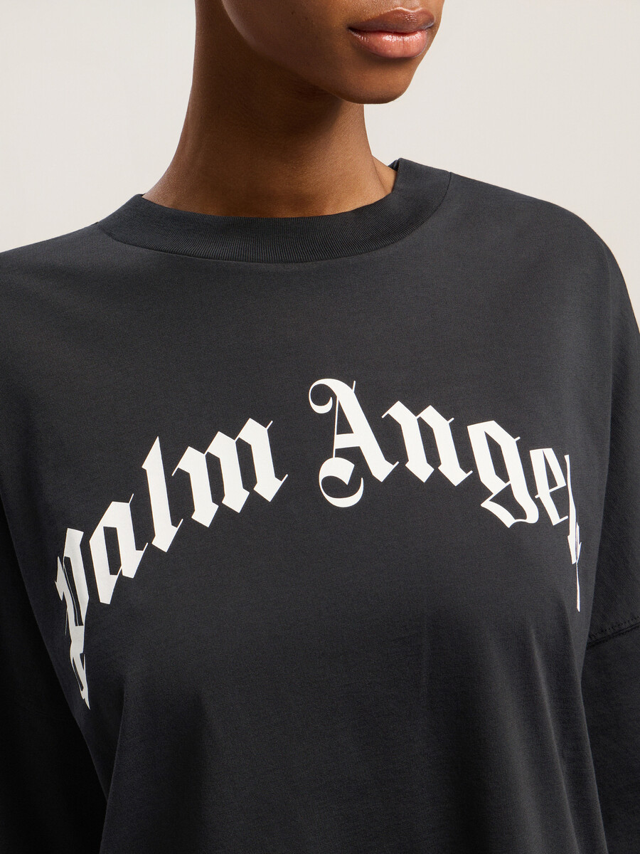 curved logo over tee